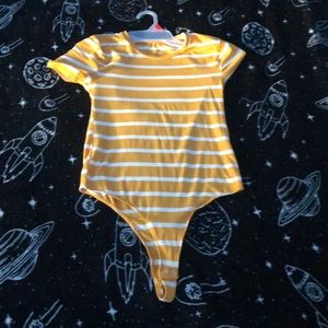 This is a yellow and white bodysuit